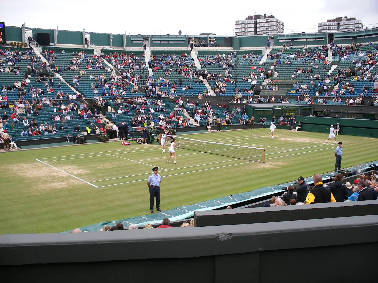 Players on Centre Court at Wimbledon.