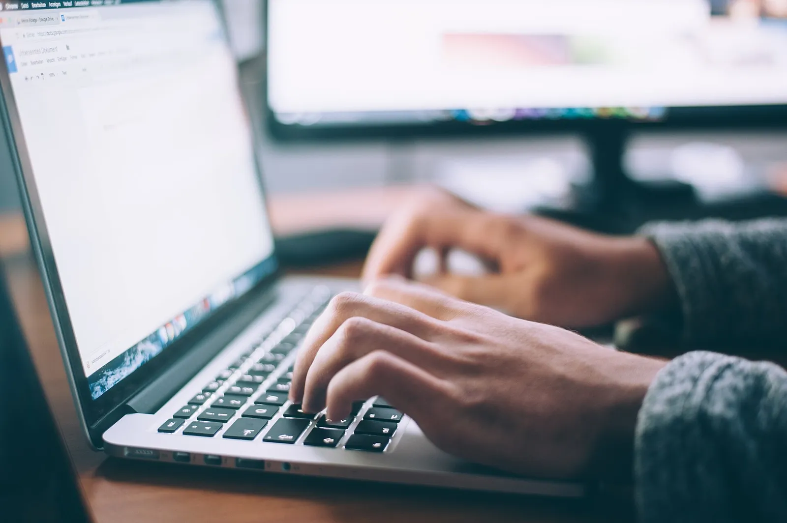 A person typing at a laptop keyboard (file photo).