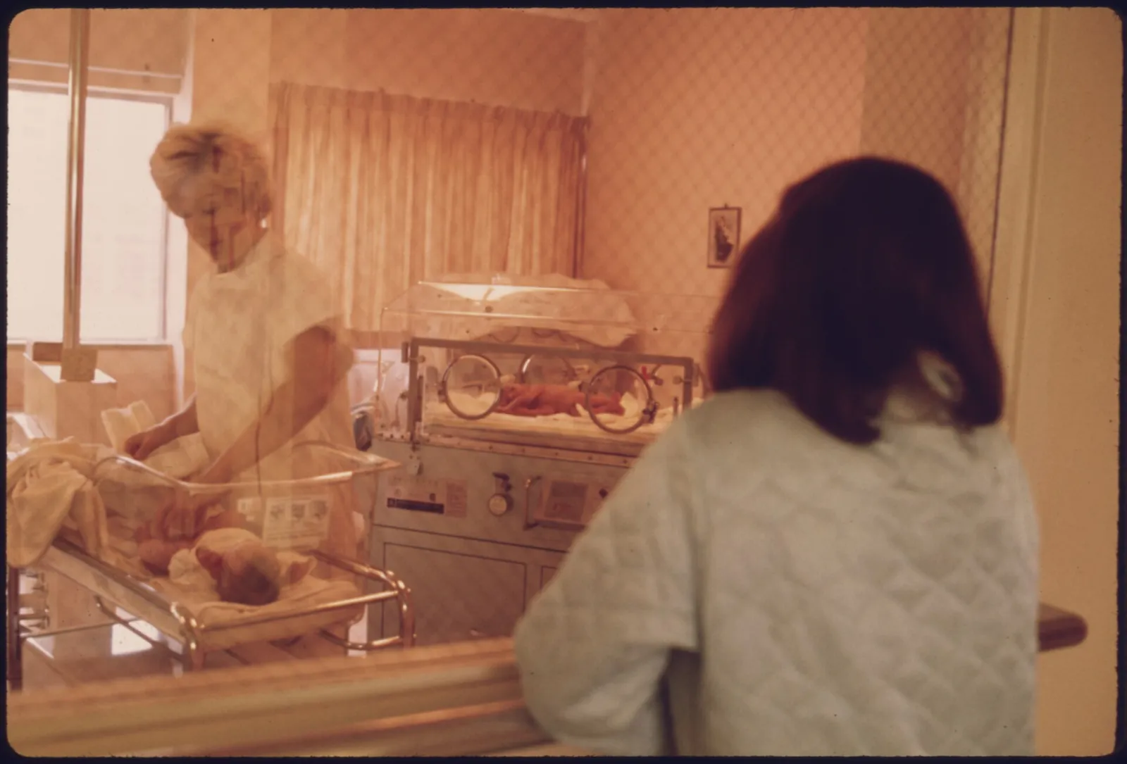A newborn in a hospital nursery