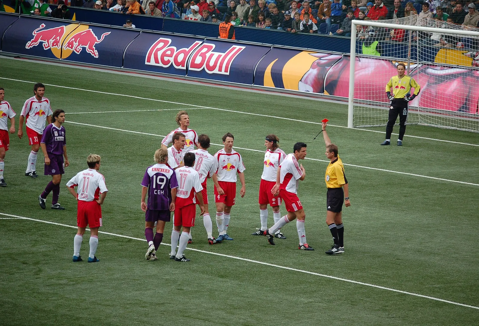 A referee holds up a red card (file photo).