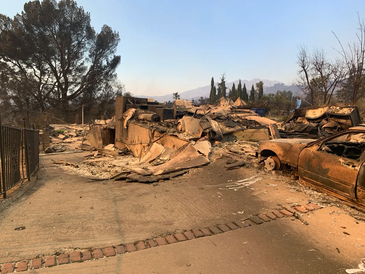 A home and vehicle destroyed by the Eaton fire in 2025.