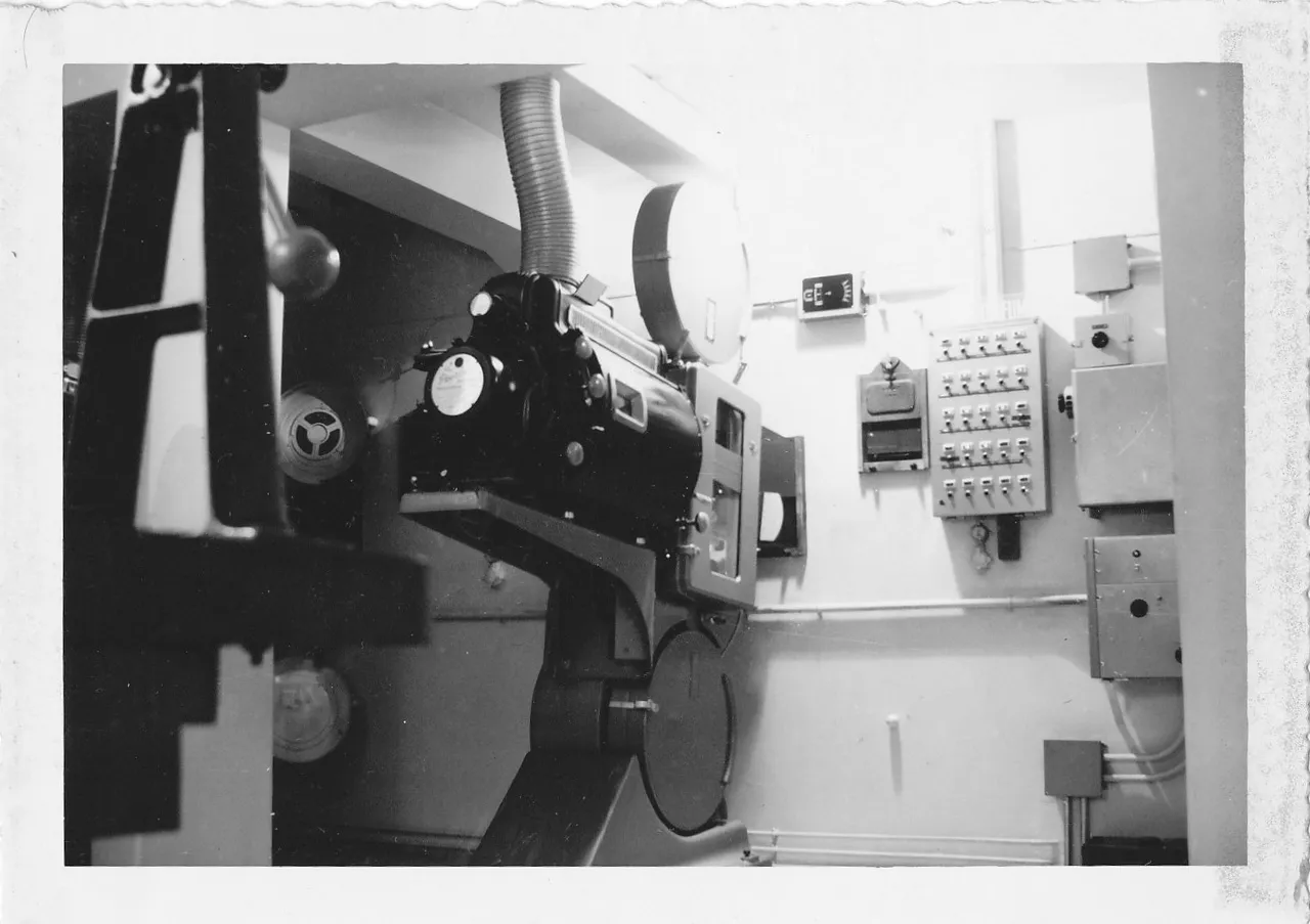 A 70mm film projector in a projection booth