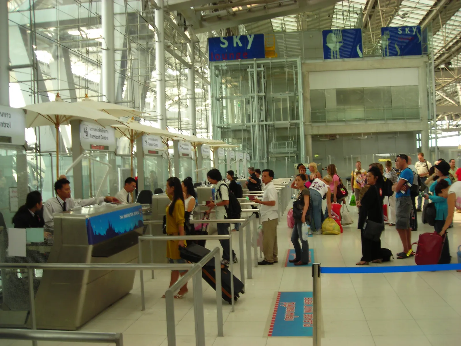 Travelers at an airport passport-control hall (file photo).