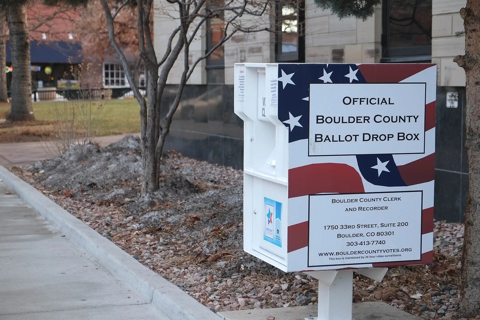 An official ballot drop box on a sidewalk