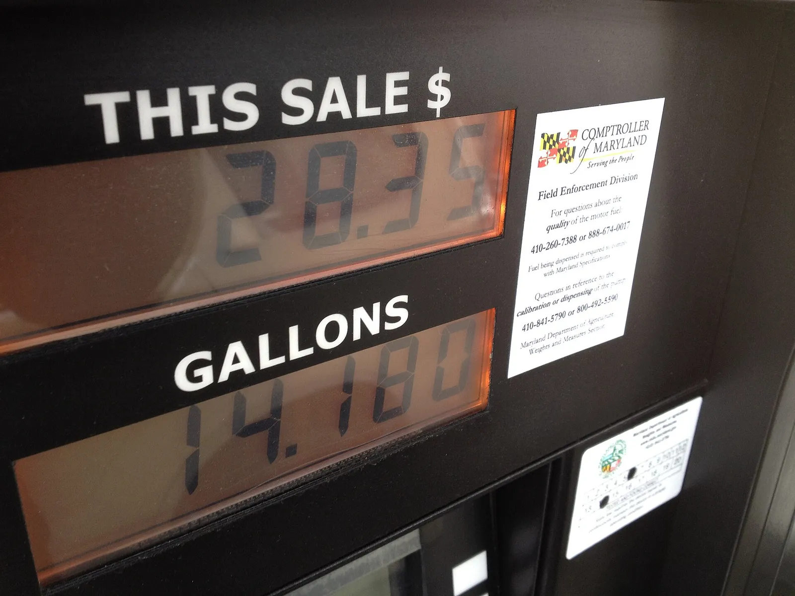 Fuel prices displayed at a gas station pump