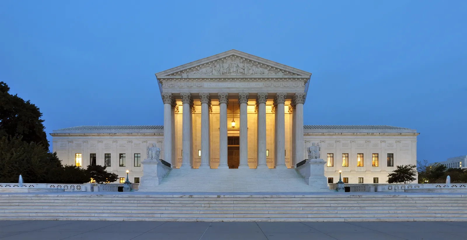 The United States Supreme Court building at dusk.