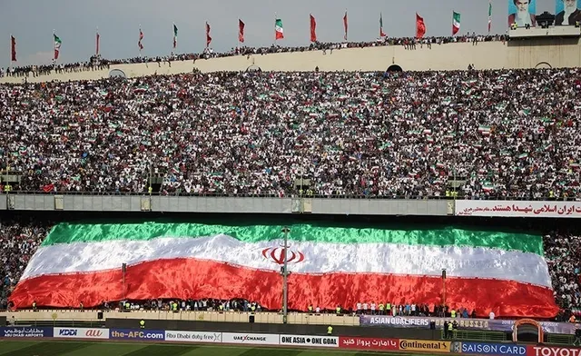An Iranian flag displayed in a football stadium.