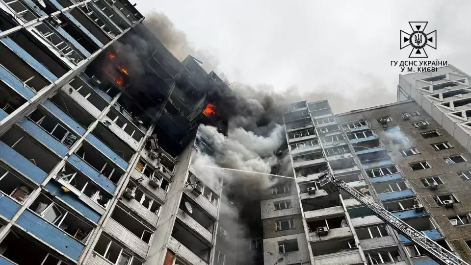 Emergency workers amid the rubble of a building in Kyiv after an earlier Russian strike.