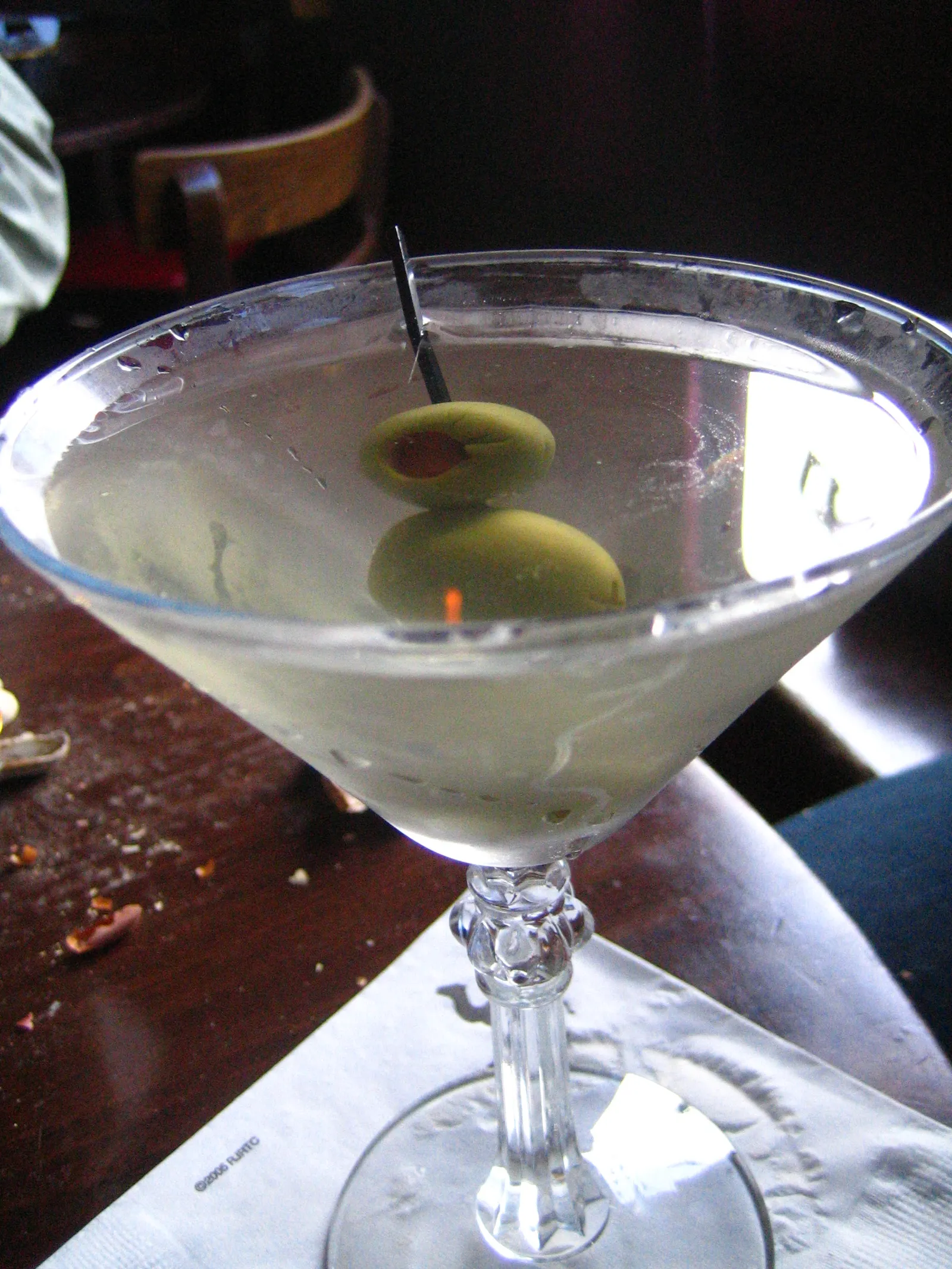 A dirty martini with olives
