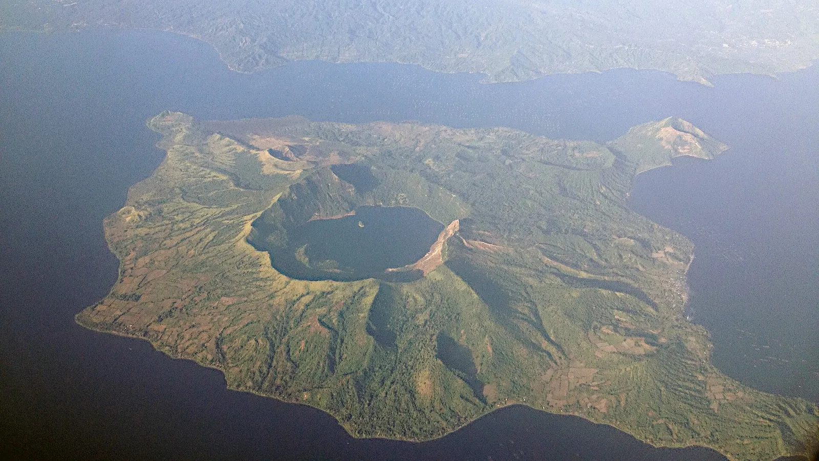 An aerial view of Taal Volcano and its crater lake in the Philippines.