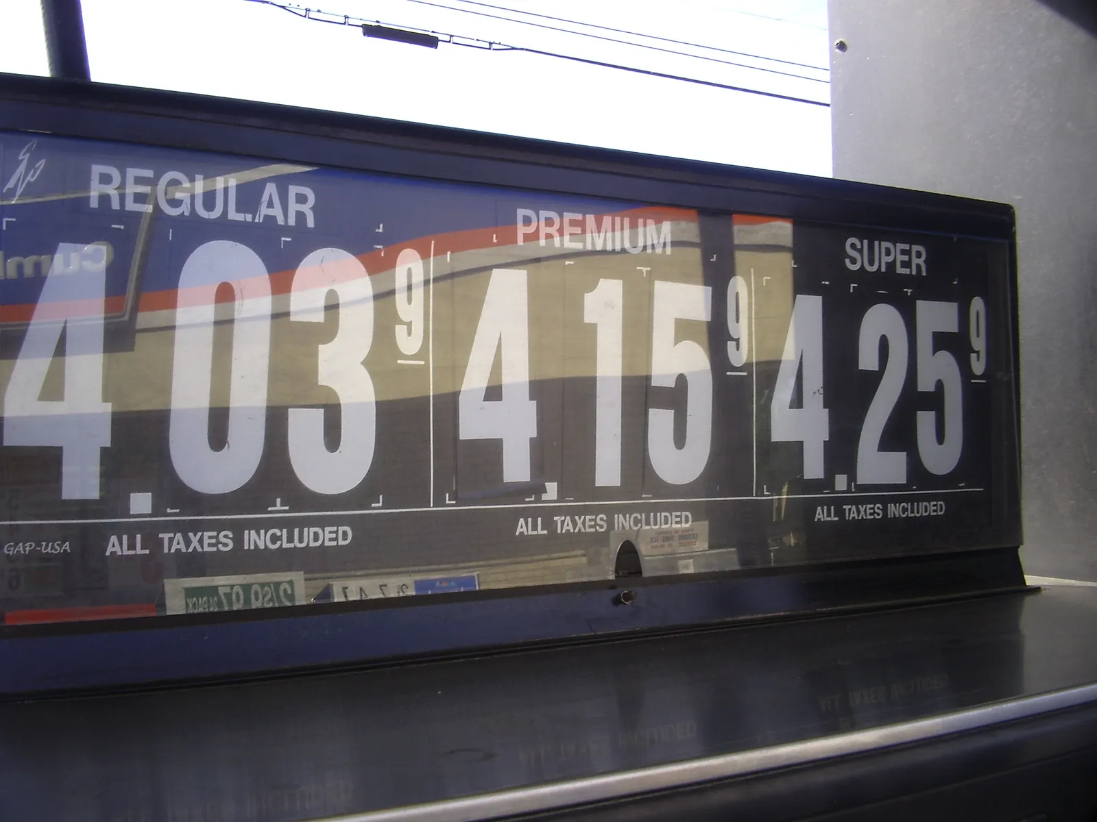 A gas-station fuel-price sign.