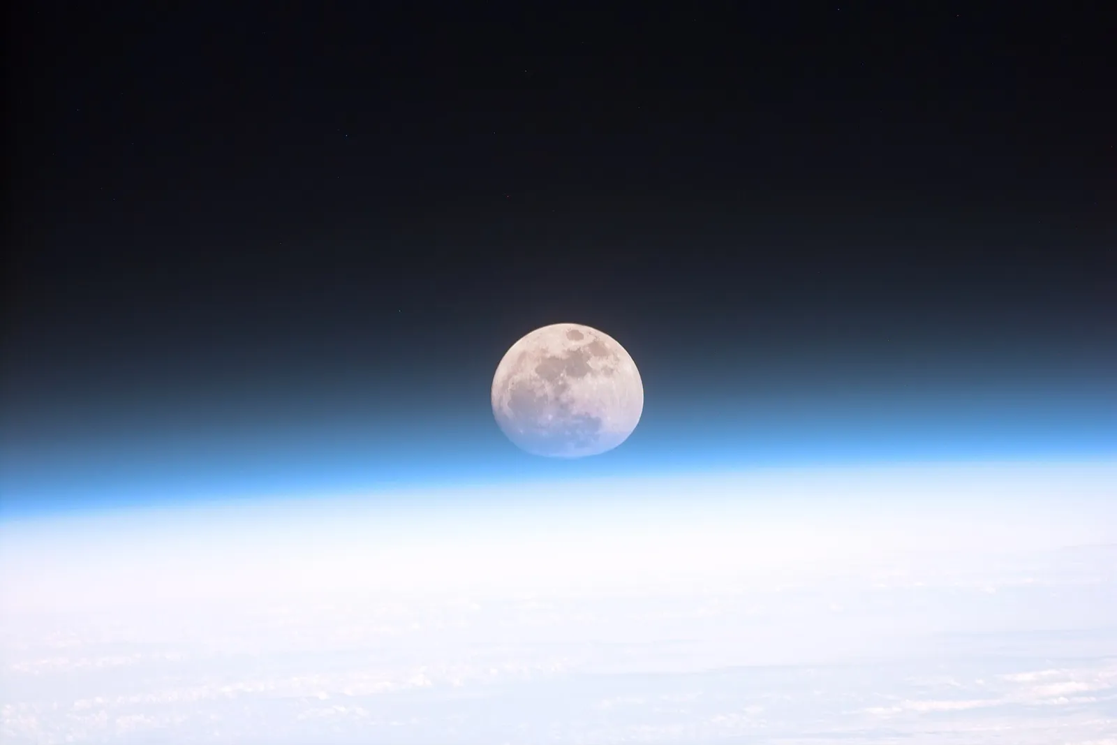 A full moon photographed through Earth's atmosphere