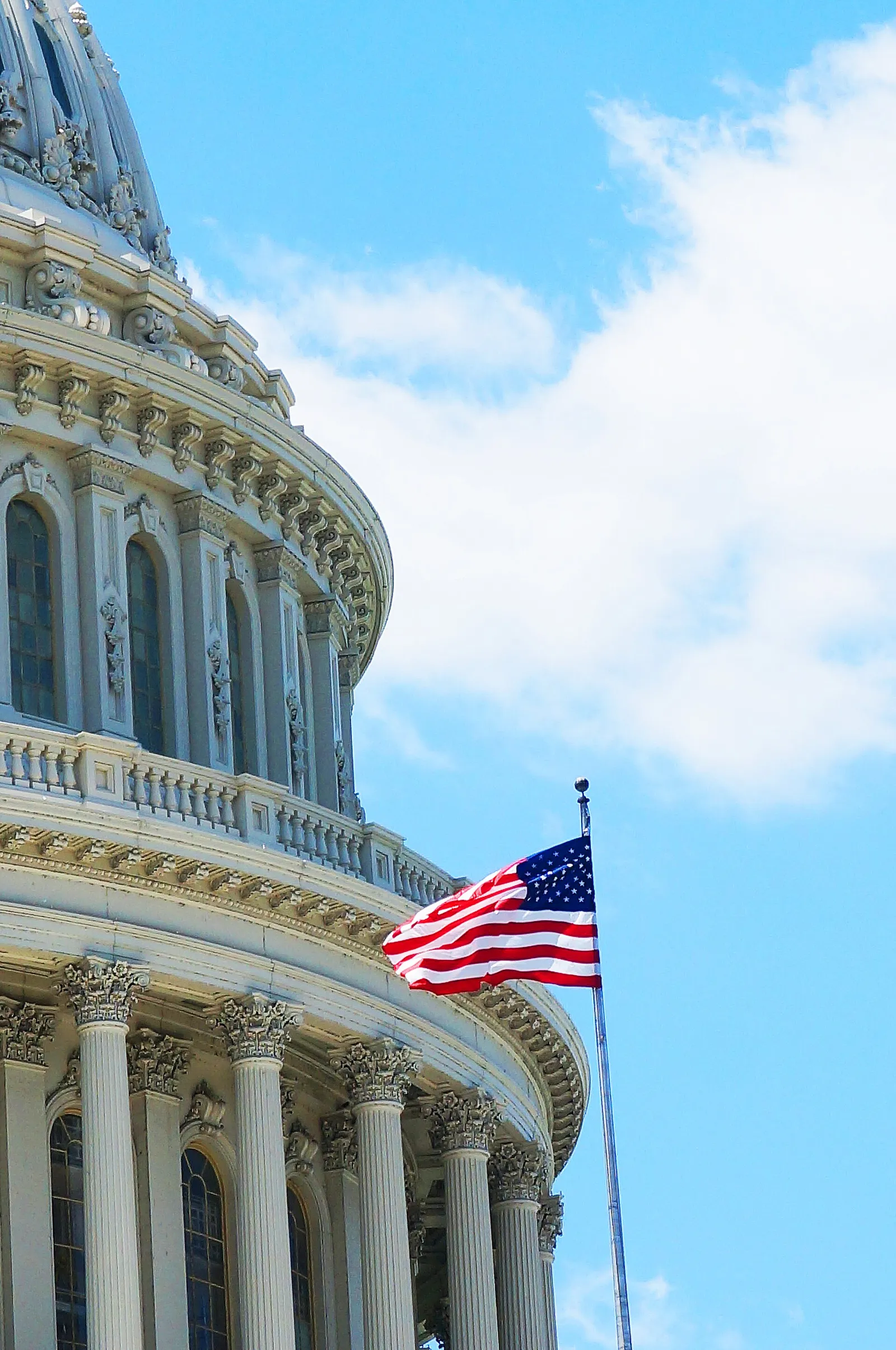 A flag flying over the United States Capitol.