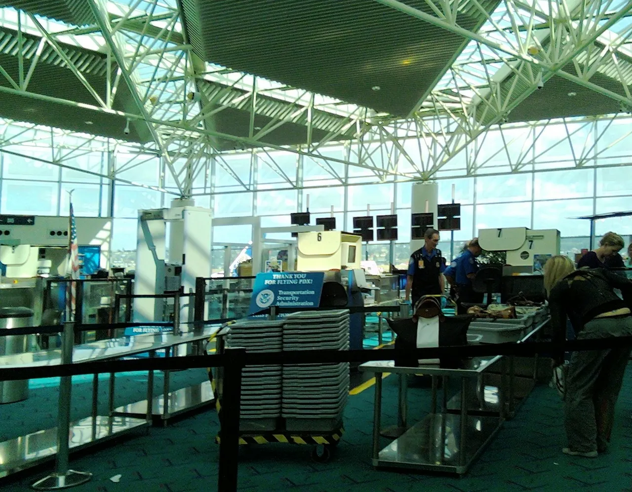 Passengers at an airport security checkpoint.
