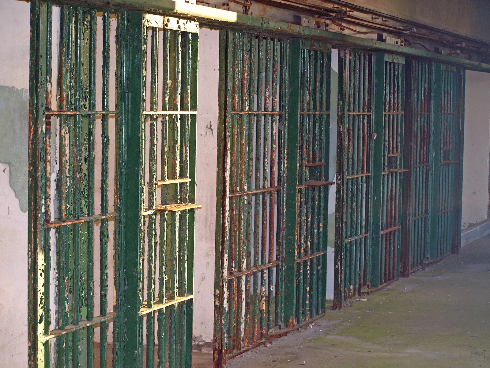 A row of cells in a jail cellblock