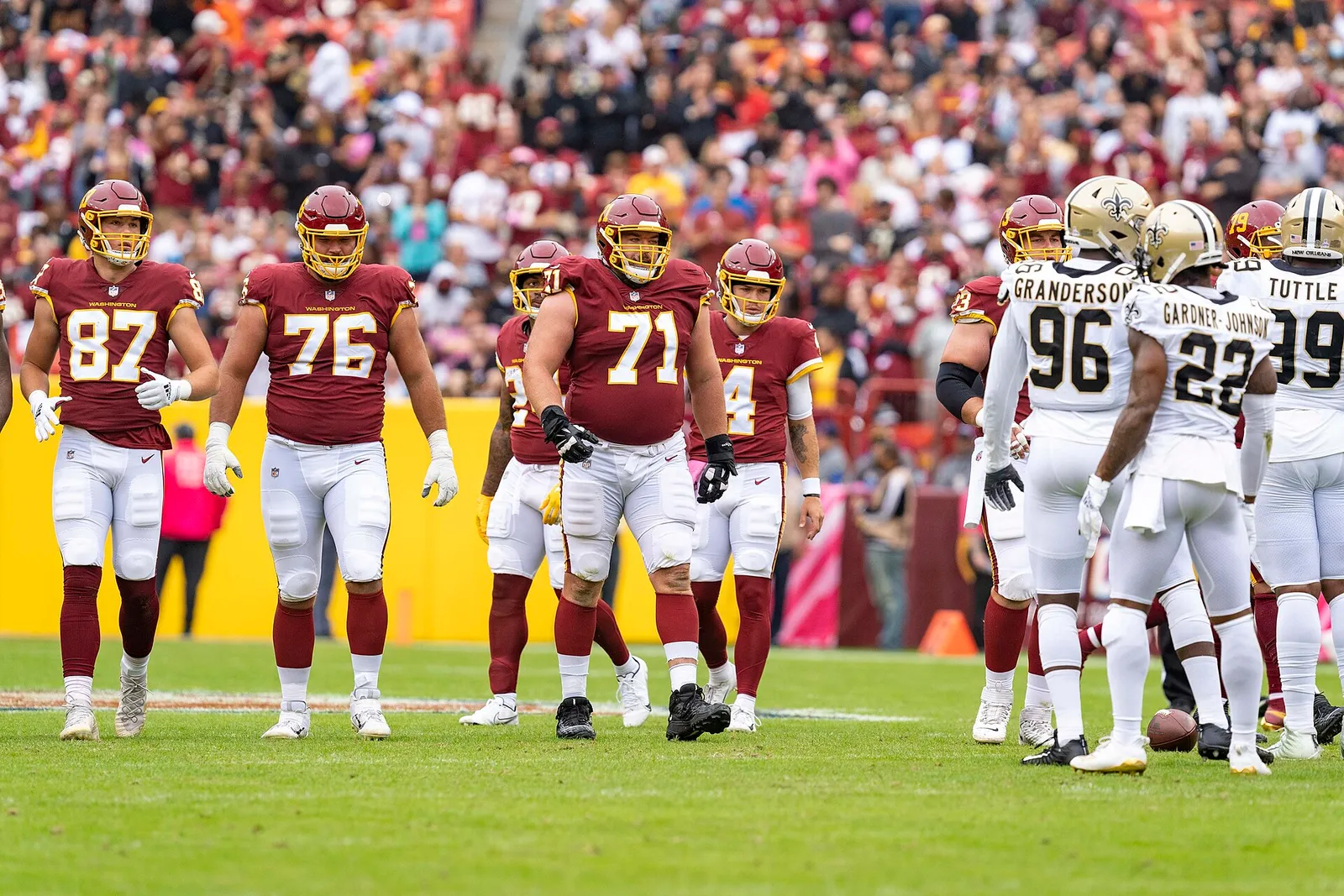 An NFL offensive line at the line of scrimmage.