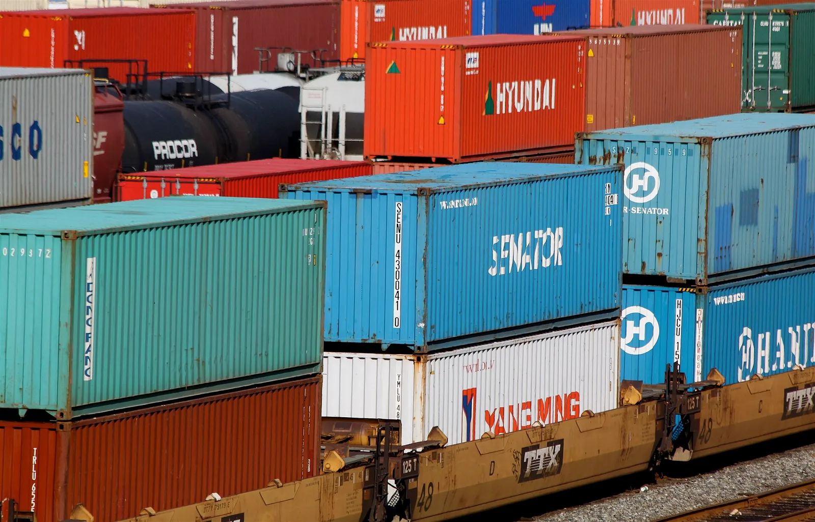 Stacked shipping containers at a port (illustrative).