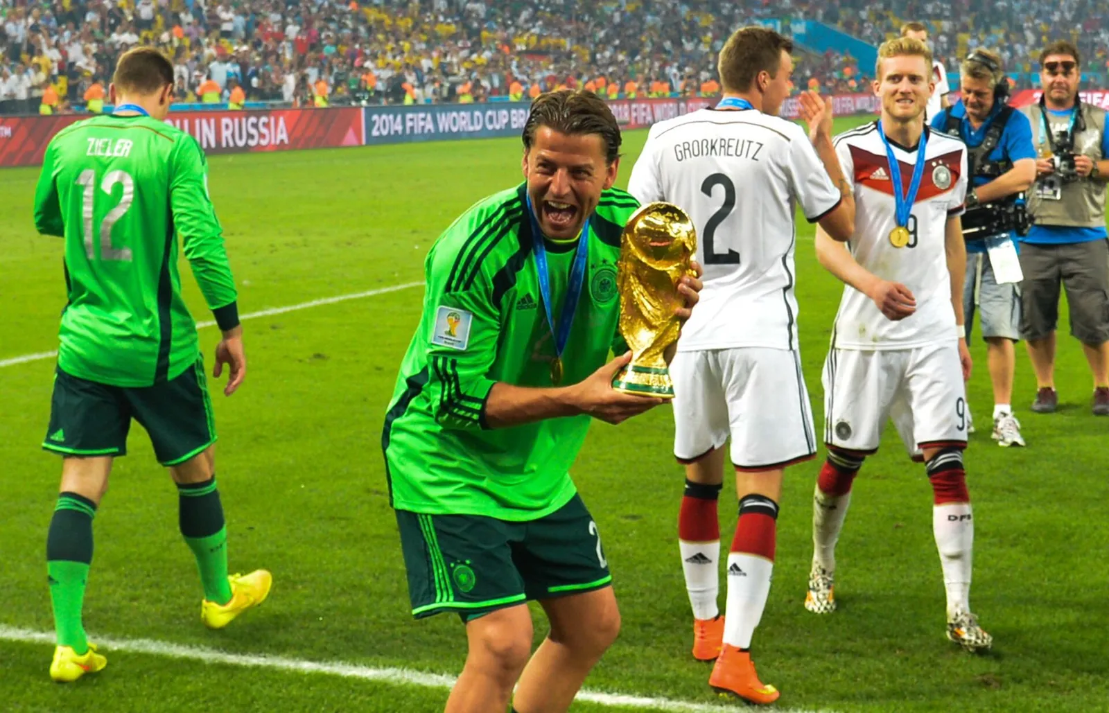 Germany goalkeeper Roman Weidenfeller holds the FIFA World Cup trophy in 2014