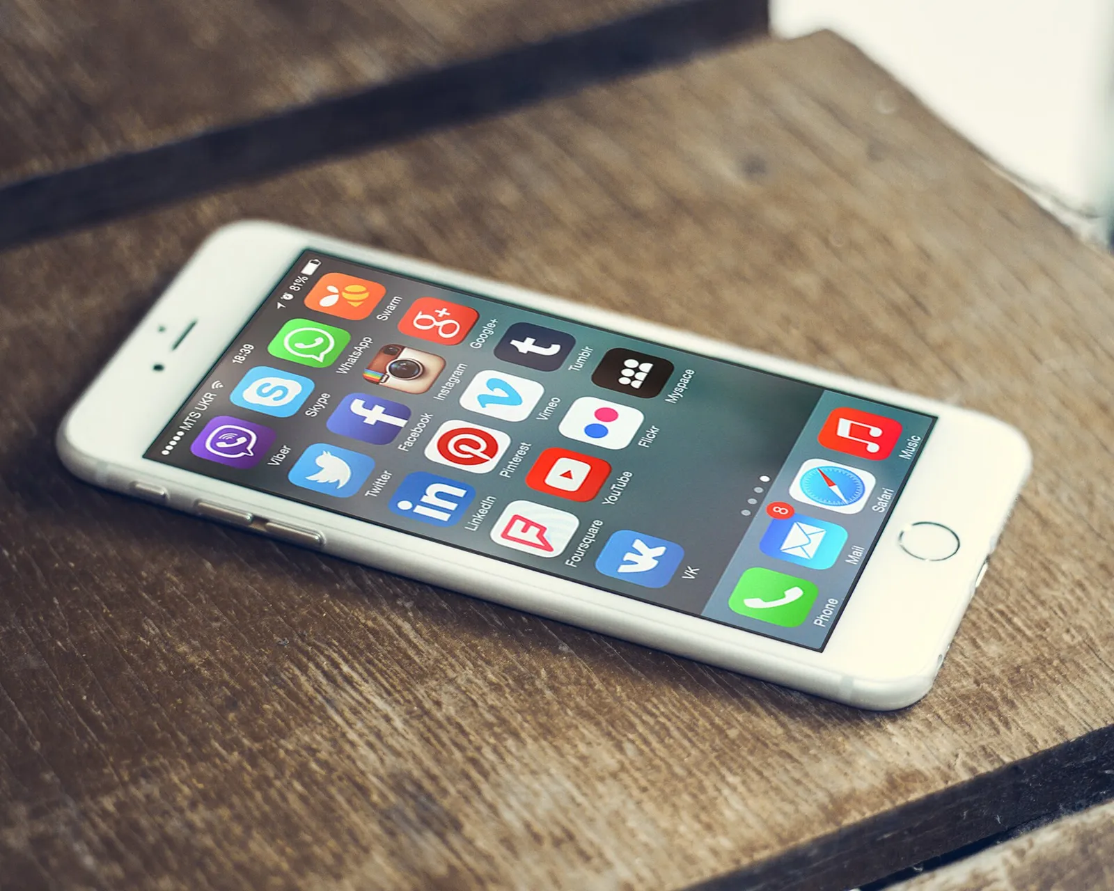 Social media app icons on a smartphone screen.