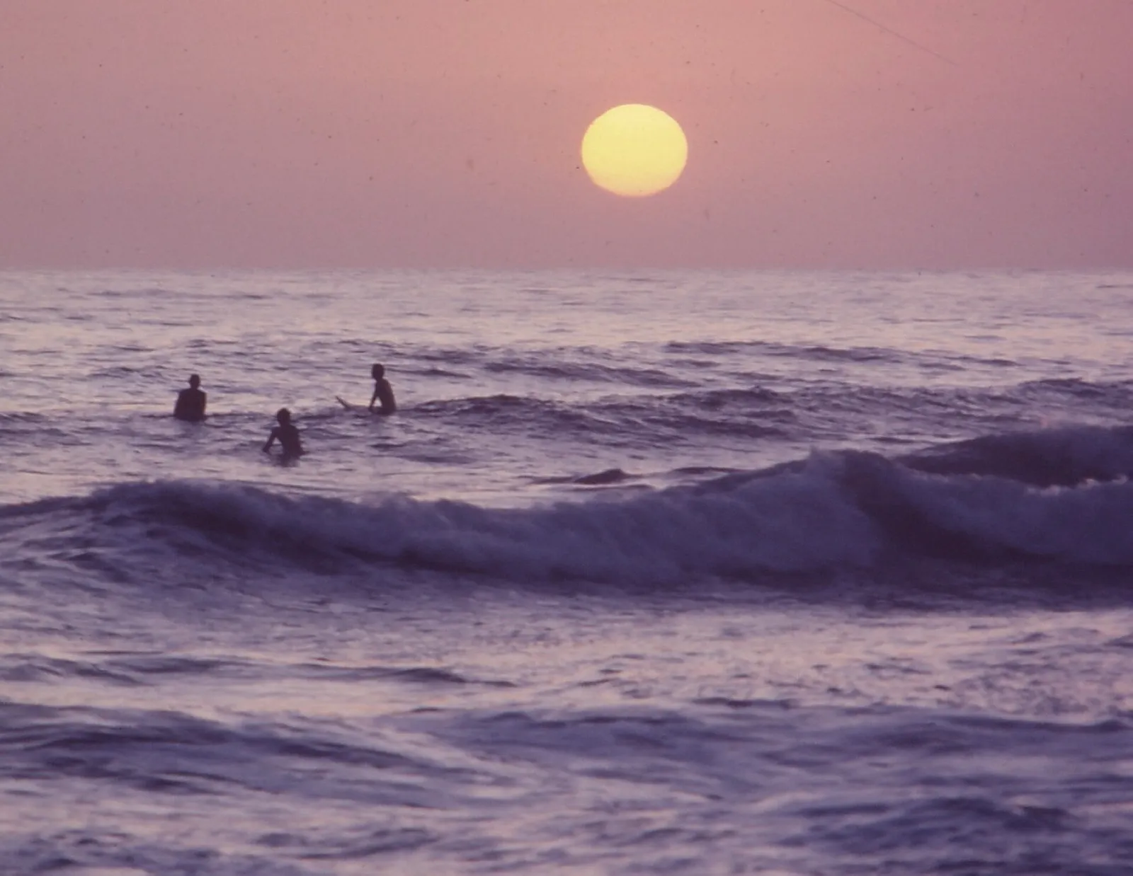 Surfers in the water off San Clemente on the Southern California coast