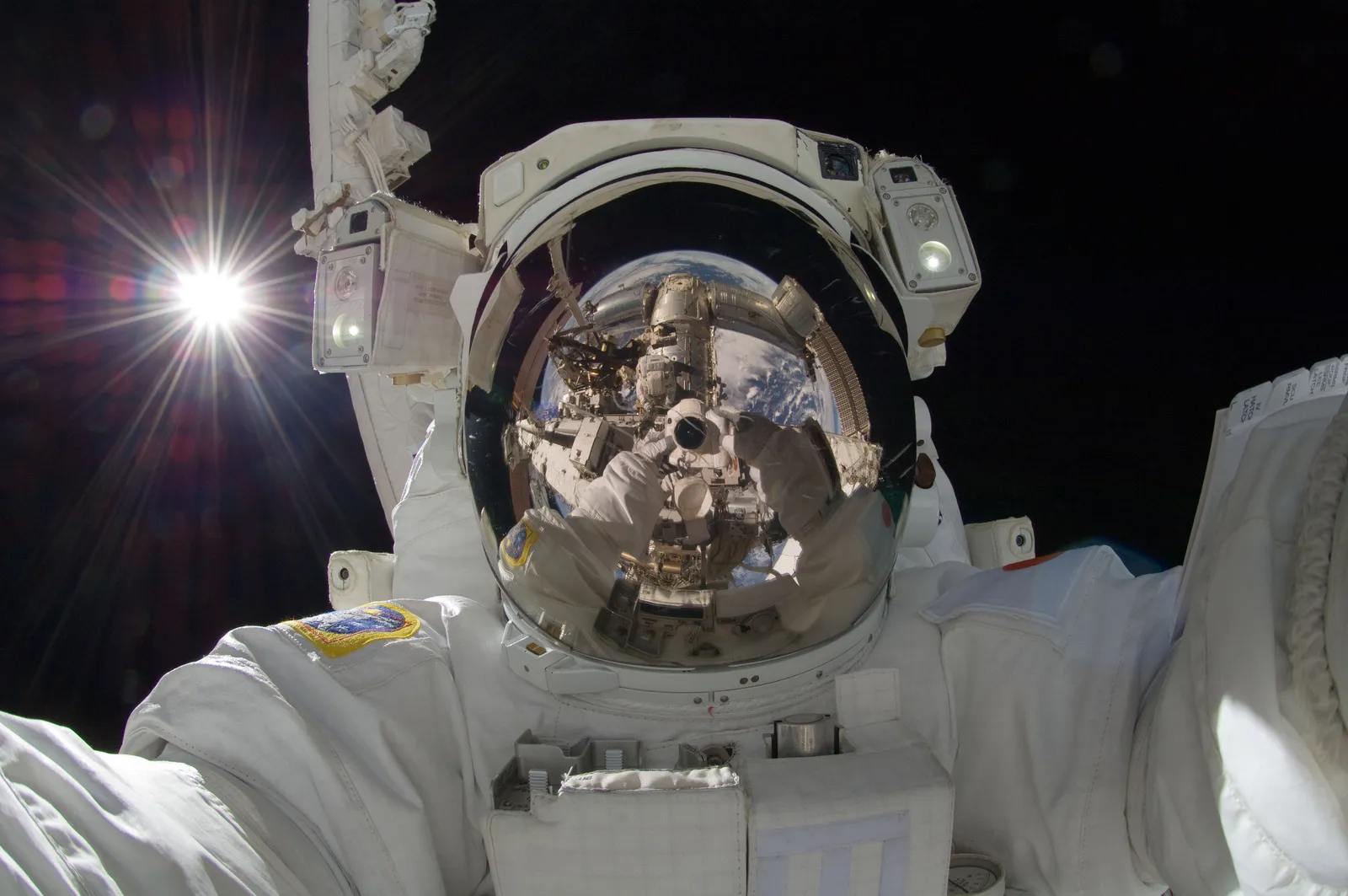 An astronaut on a spacewalk outside the International Space Station.