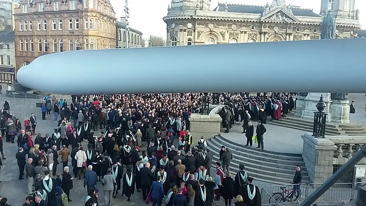 University graduates in caps and gowns.