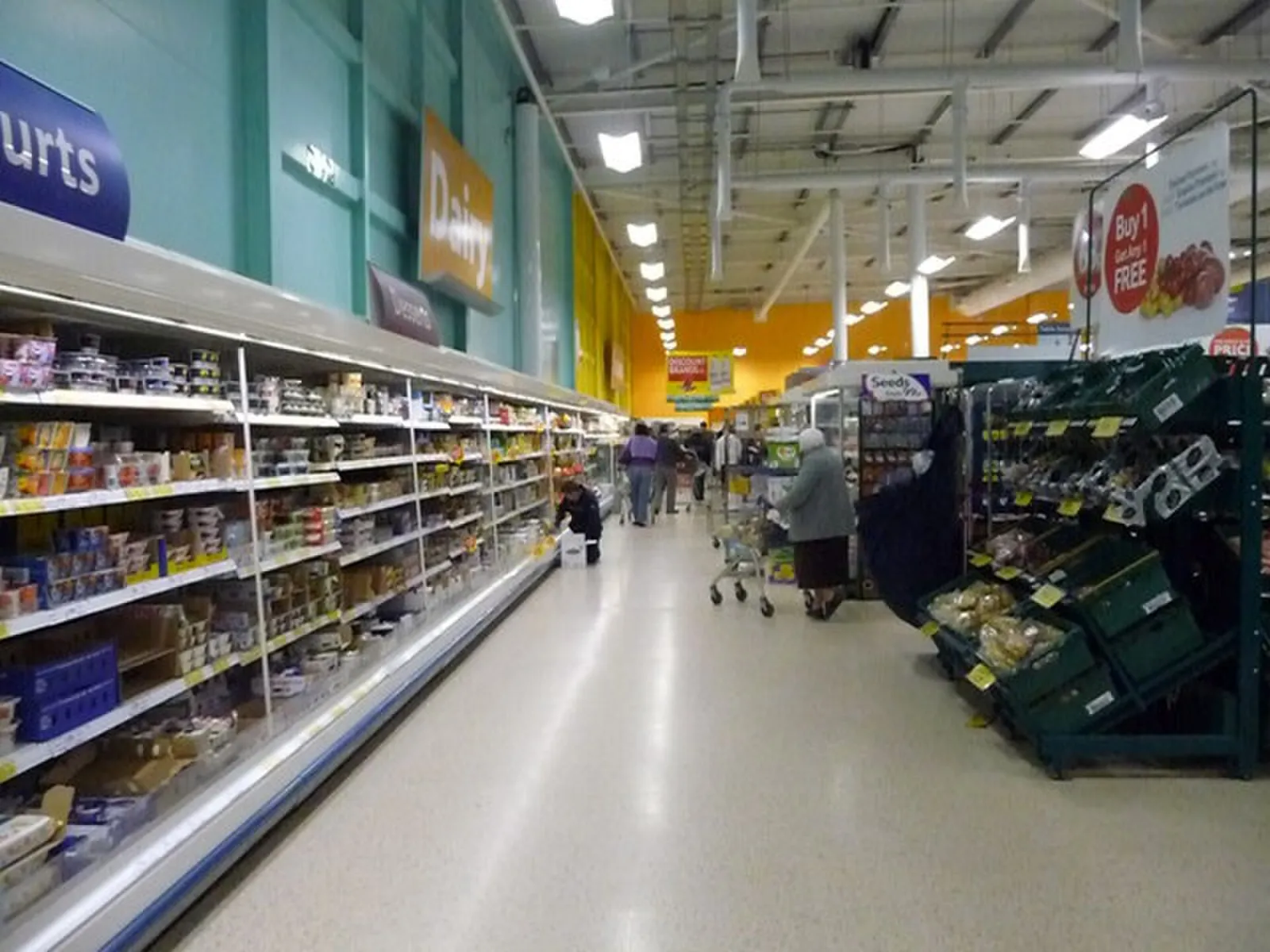 A refrigerated dairy aisle in a supermarket.