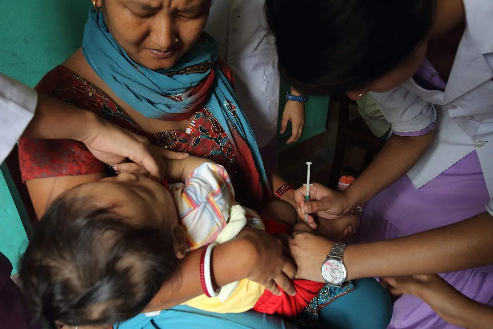 A child receives a vaccination at an immunization clinic