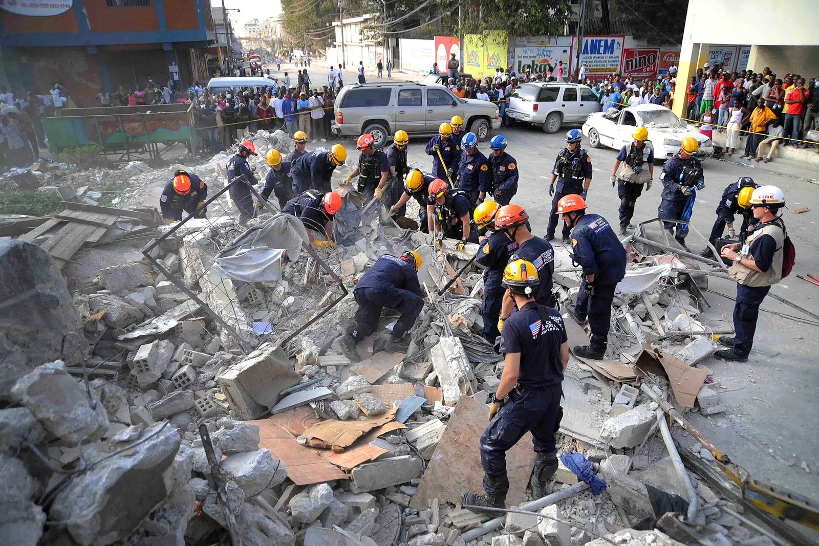 A Los Angeles County Fire Department search-and-rescue team works on a collapsed building after an earthquake.