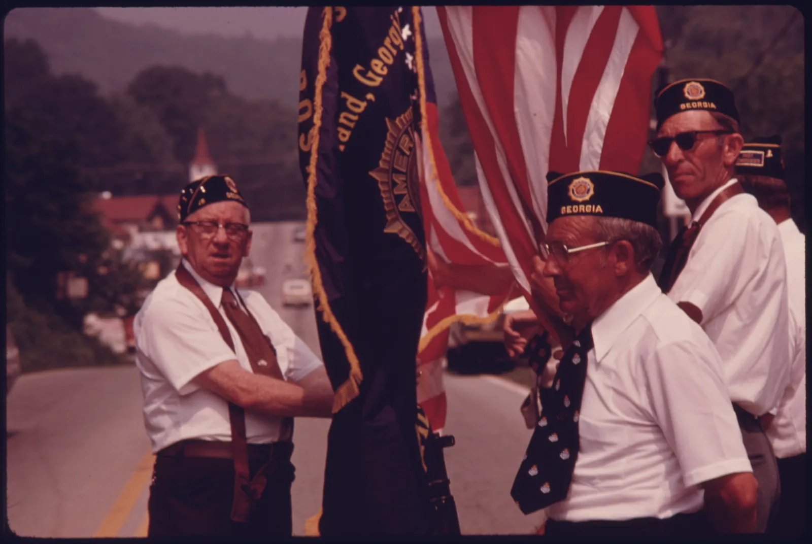 An American flag carried in a Fourth of July parade.