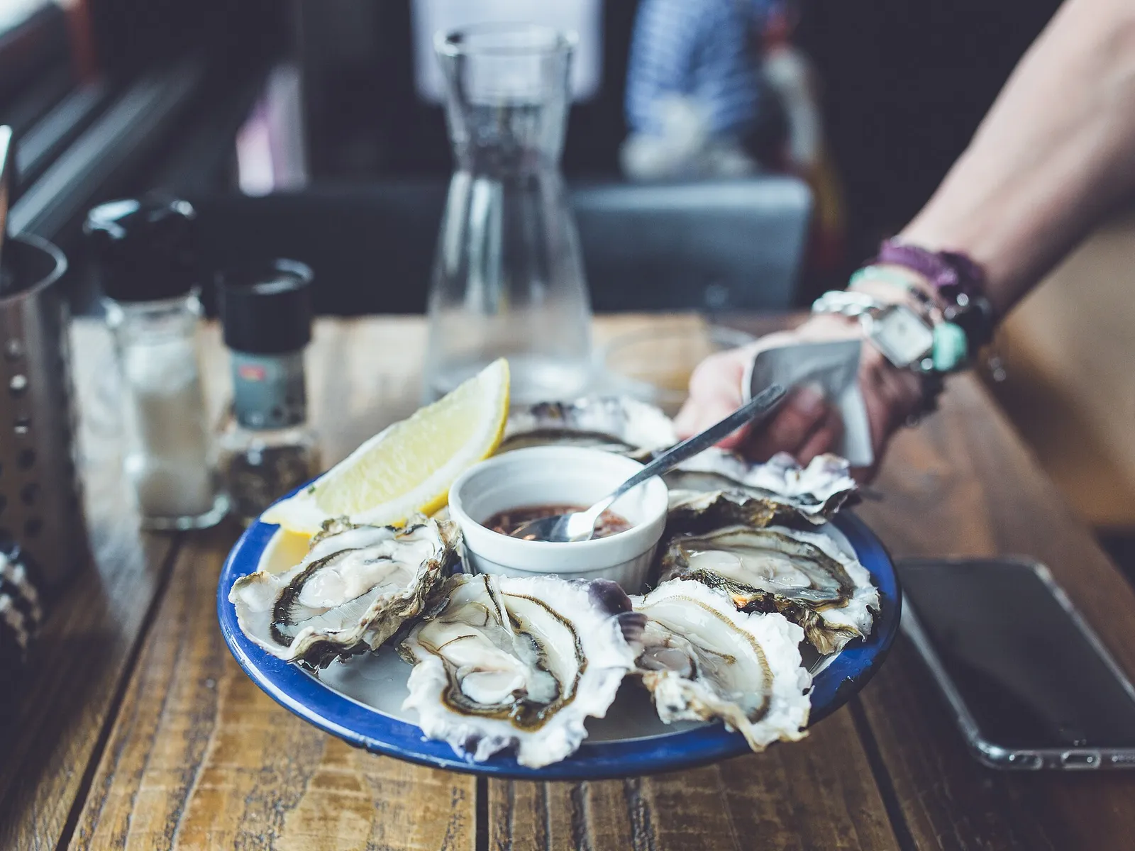 Raw oysters served on ice — a common source of Vibrio infection.