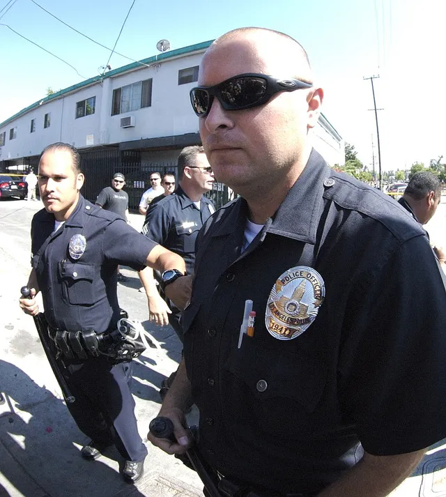 Los Angeles Police Department officers at a scene.