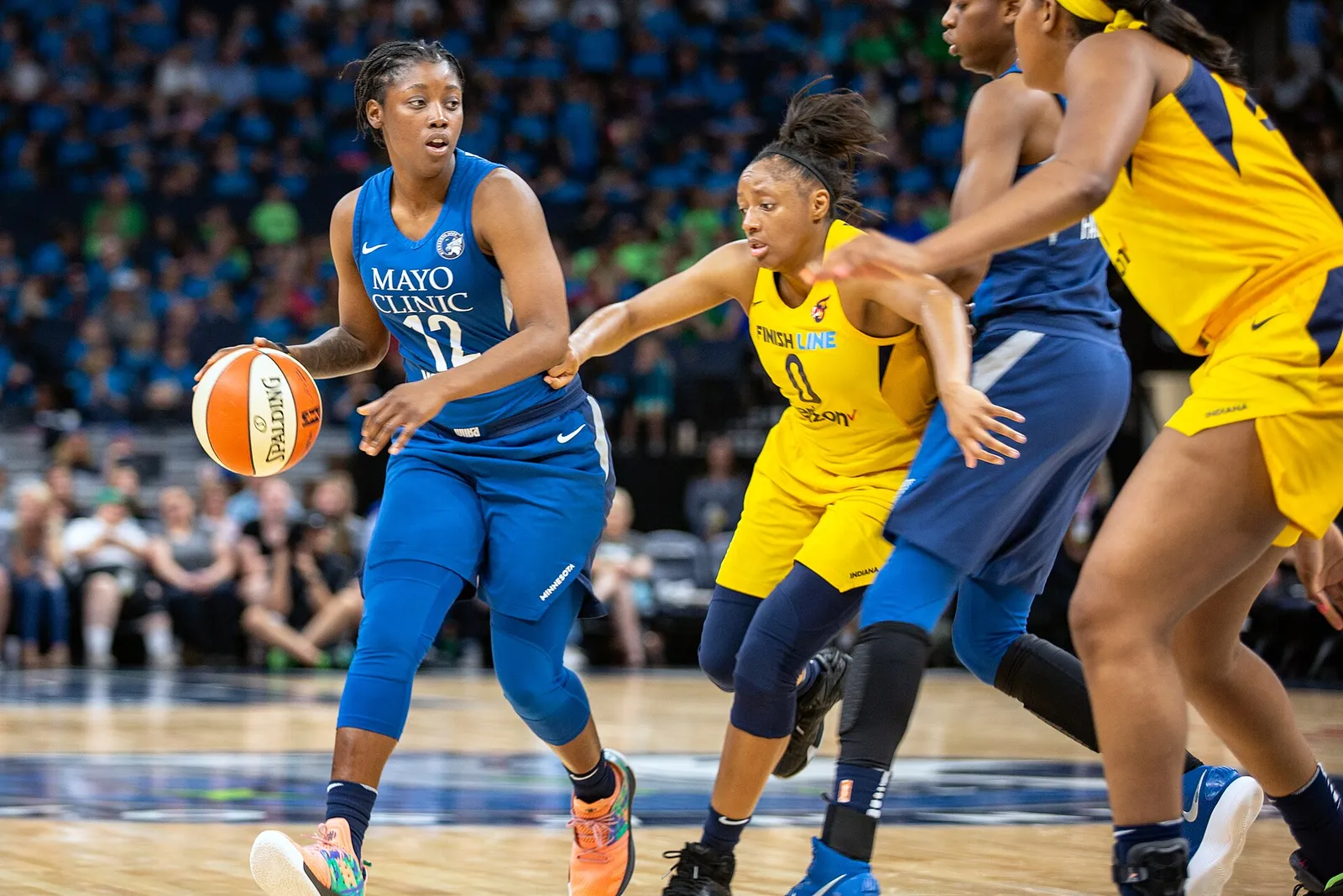 Indiana Fever guard Kelsey Mitchell defends during a game against the Minnesota Lynx.