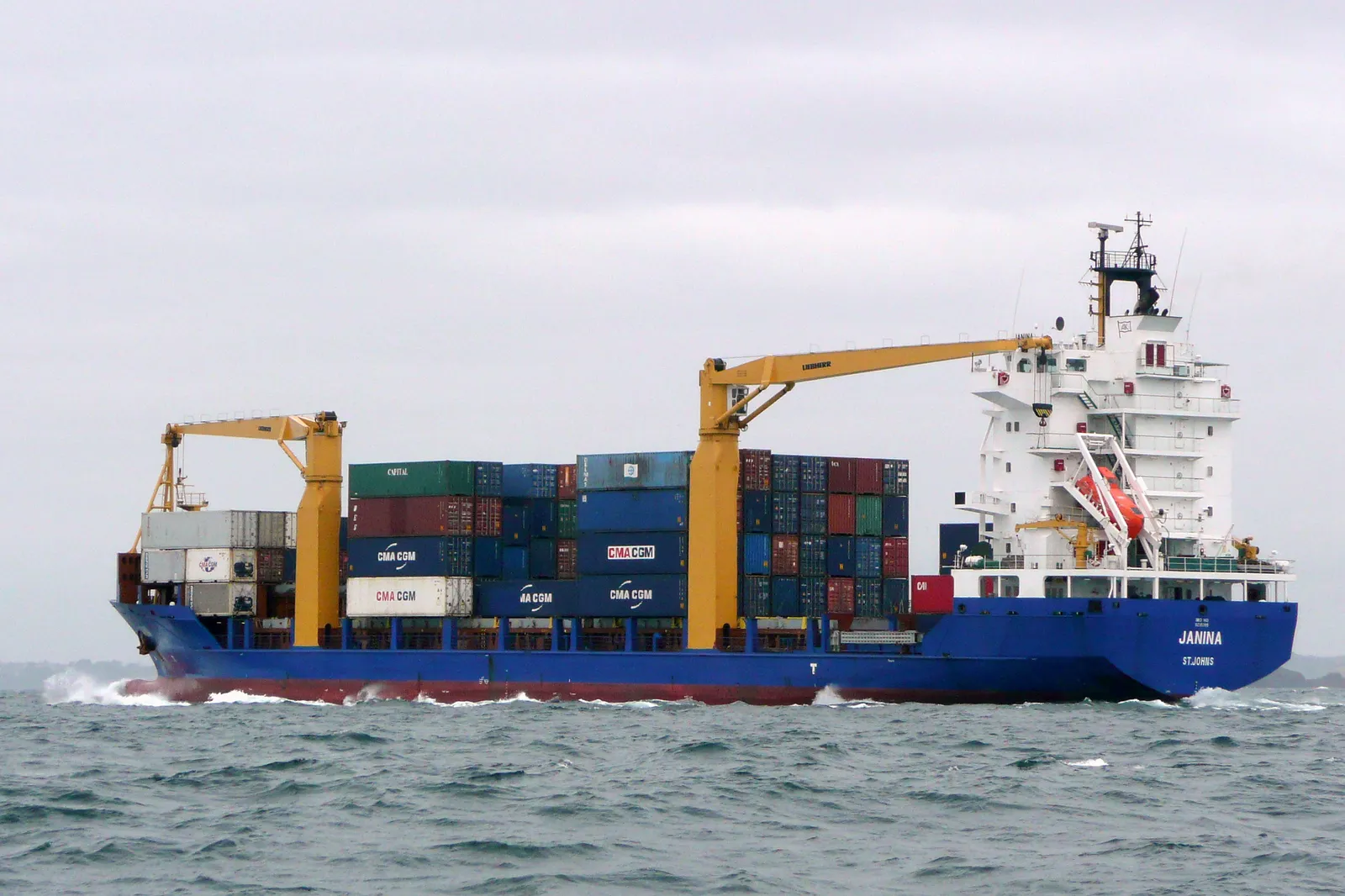 A container ship carrying cargo at sea.