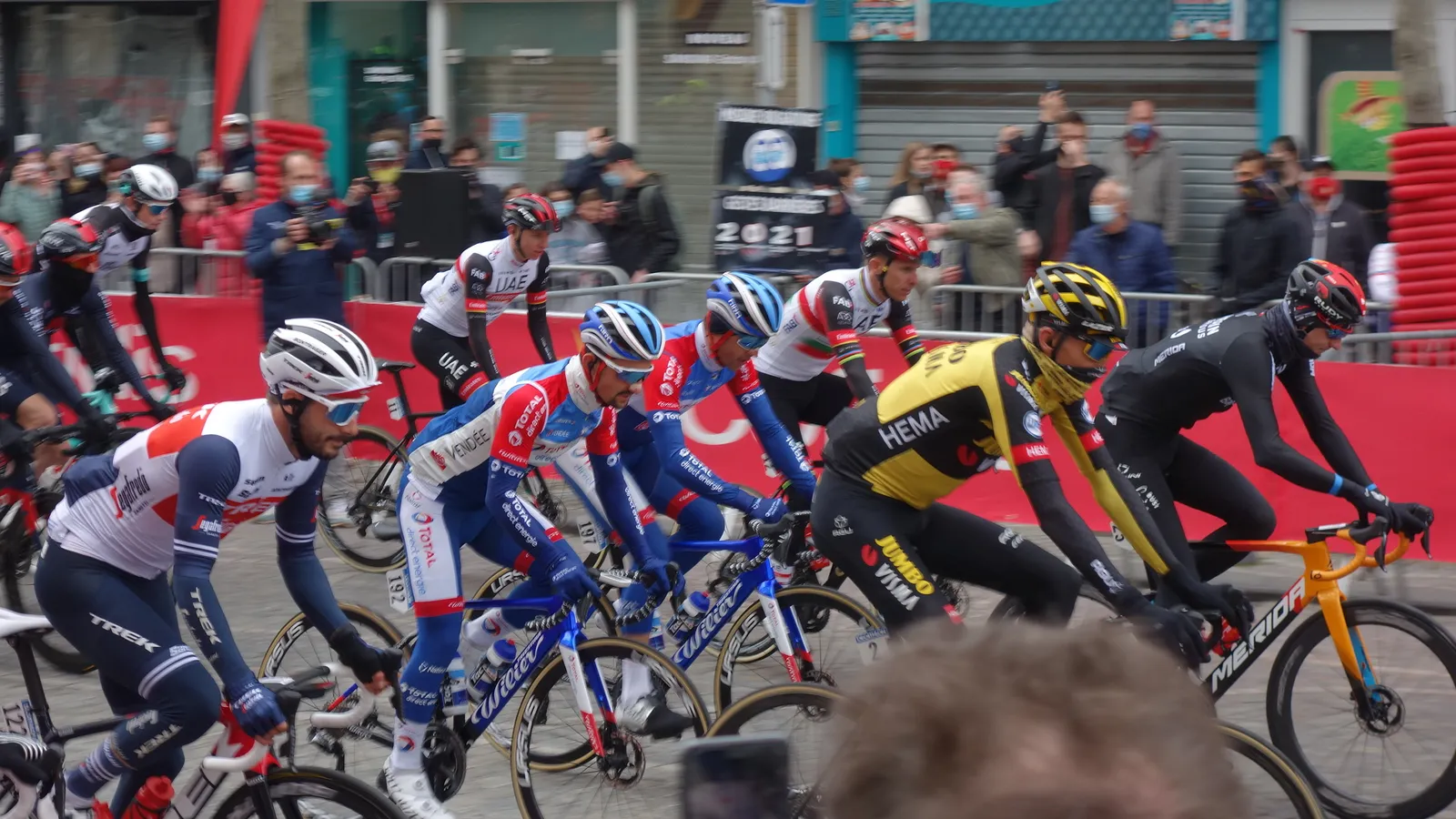 The peloton at the start of a professional road cycling race.