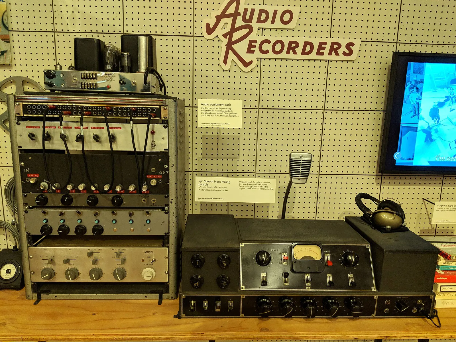 A vintage broadcast mixing console on display at a museum