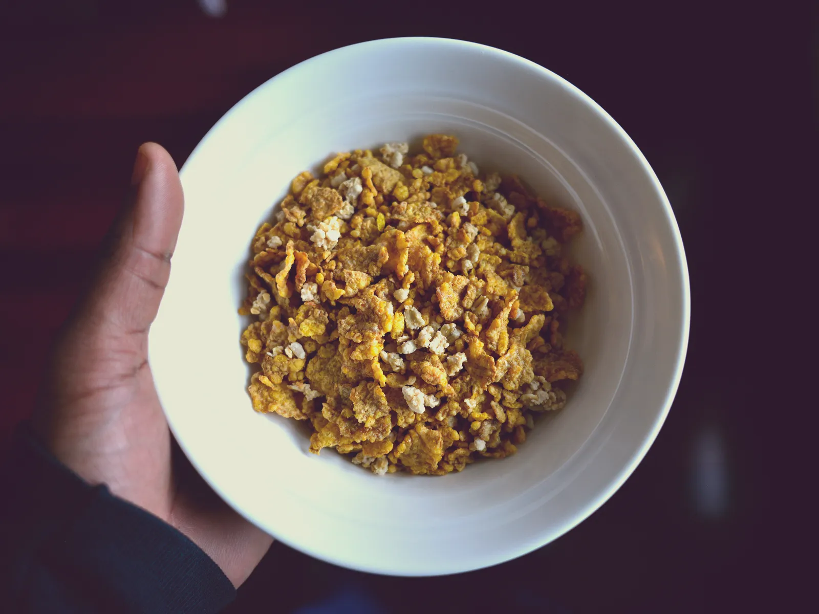 A bowl of breakfast cereal with milk.