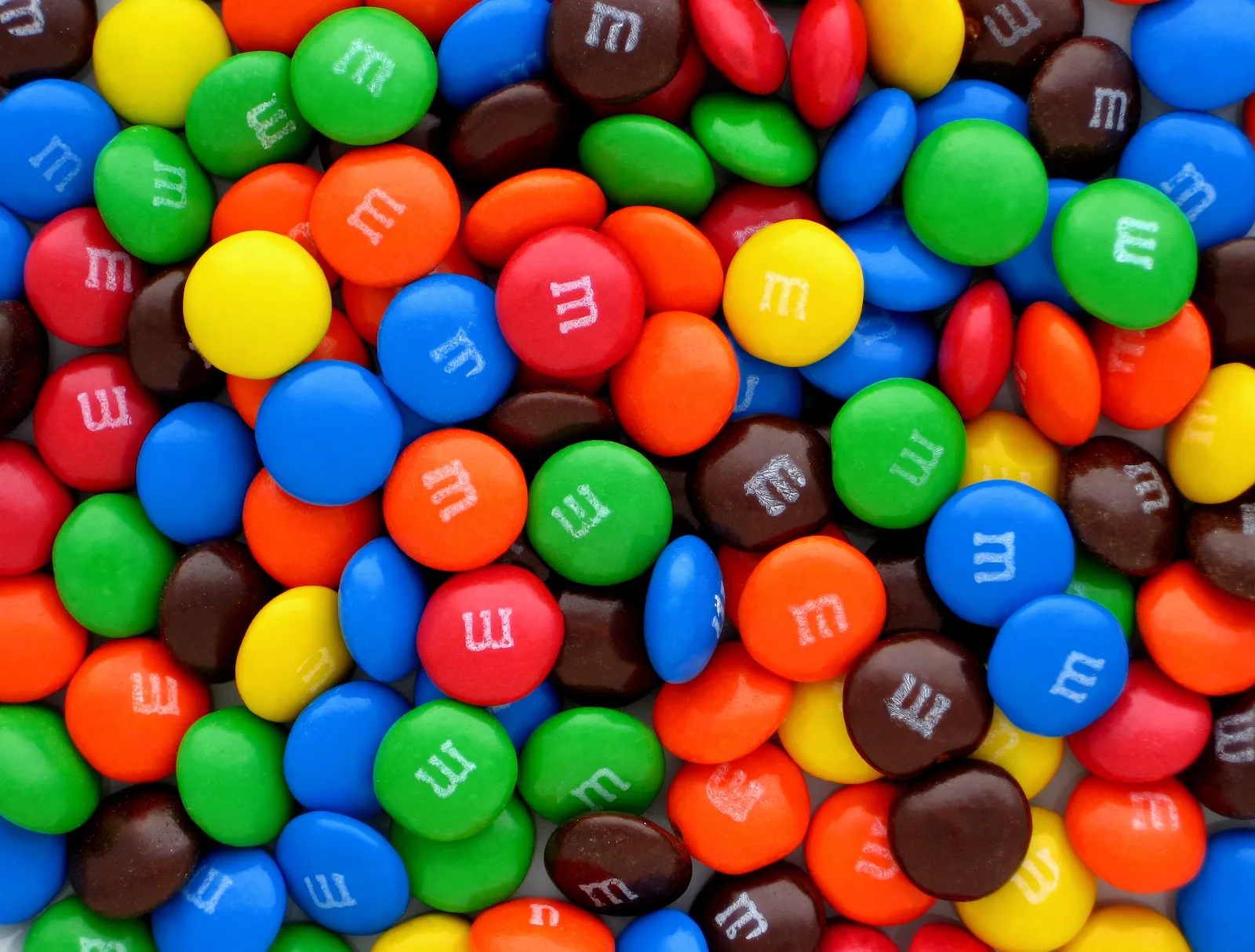A pile of plain M&M's candies.